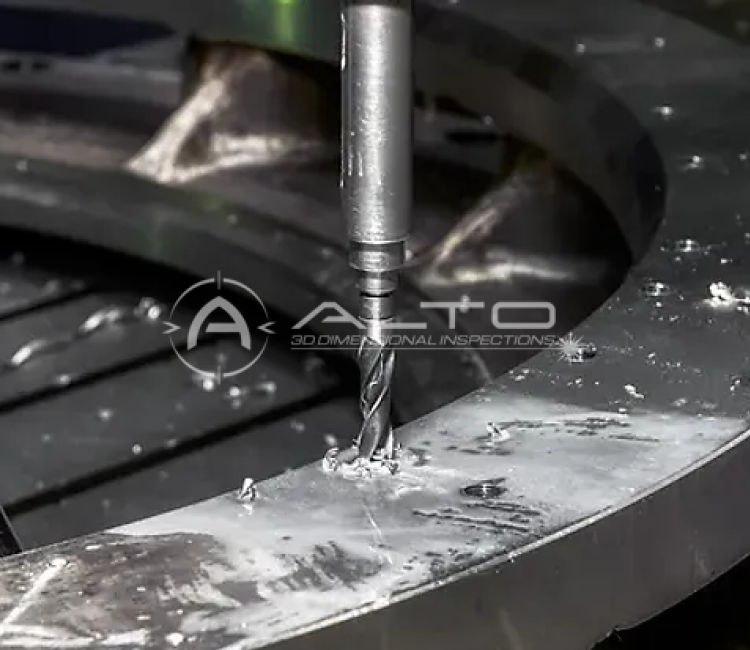 A vertical milling tool drilling a bolt hole into a large circular steel flange during on-site machining, illustrating the precise alignment and real-time process monitoring required for industrial equipment installations.
