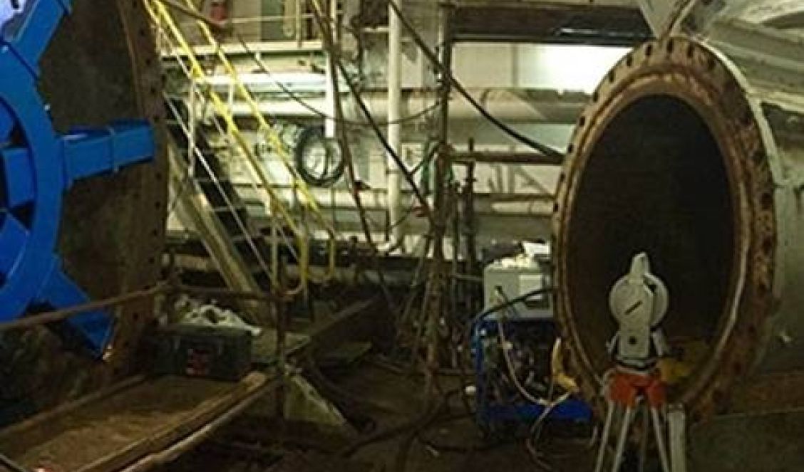 On-site machine alignment using a portable laser tracker to measure and align large, non-dismantlable industrial machinery components.
