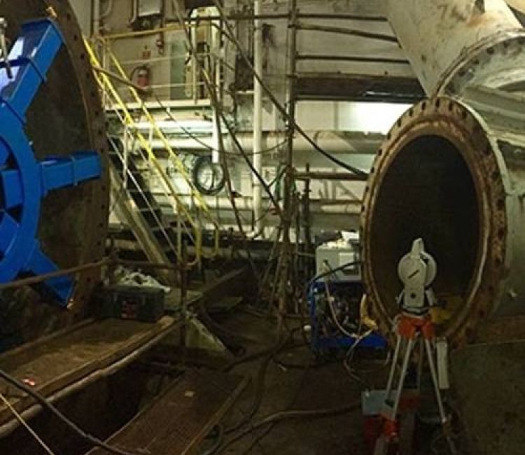 On-site machine alignment using a portable laser tracker to measure and align large, non-dismantlable industrial machinery components.