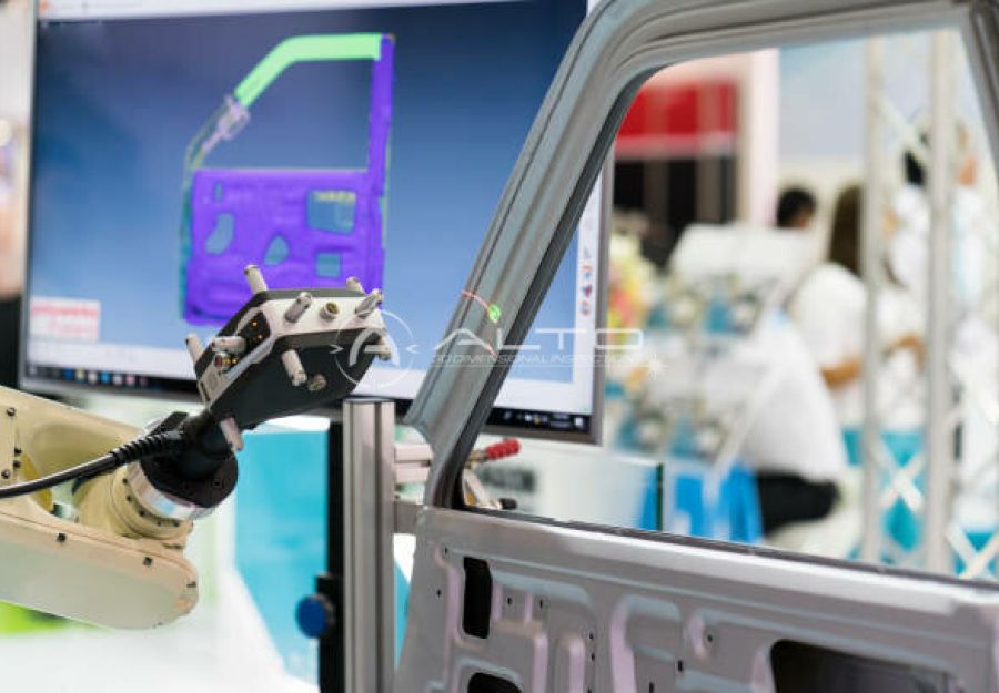 Automated robotic measurement cell performing inspection on an automotive component.