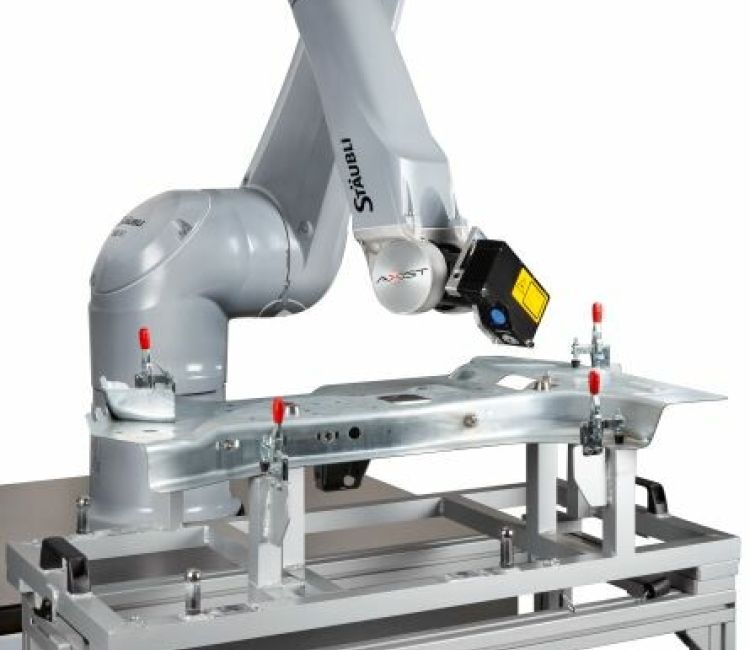 Tailored AXIST robotics automated metrology solution designed for unique automotive part inspection requirements.
