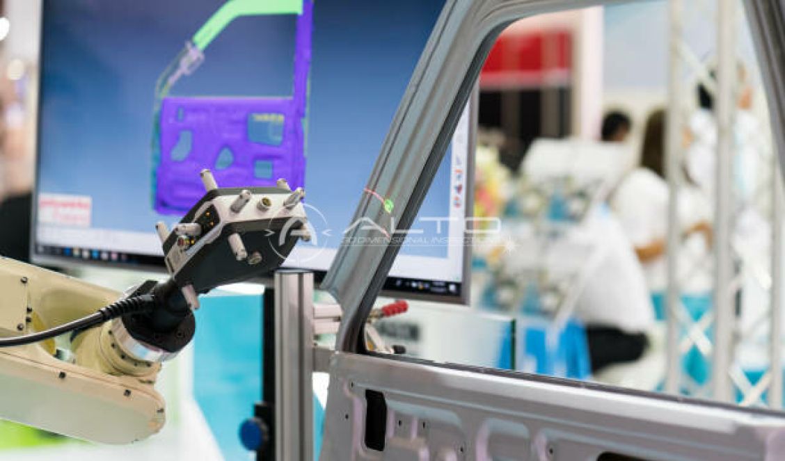 Automated robotic measurement cell performing inspection on an automotive component.